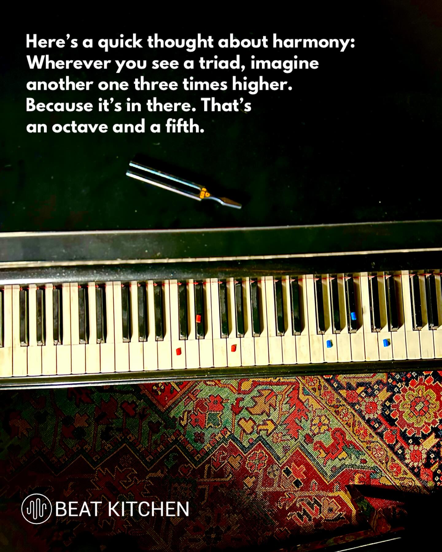 Photo looking down at a piano keyboard with a tuning fork, text overlay about imagining a triad three times higher to find the overtone